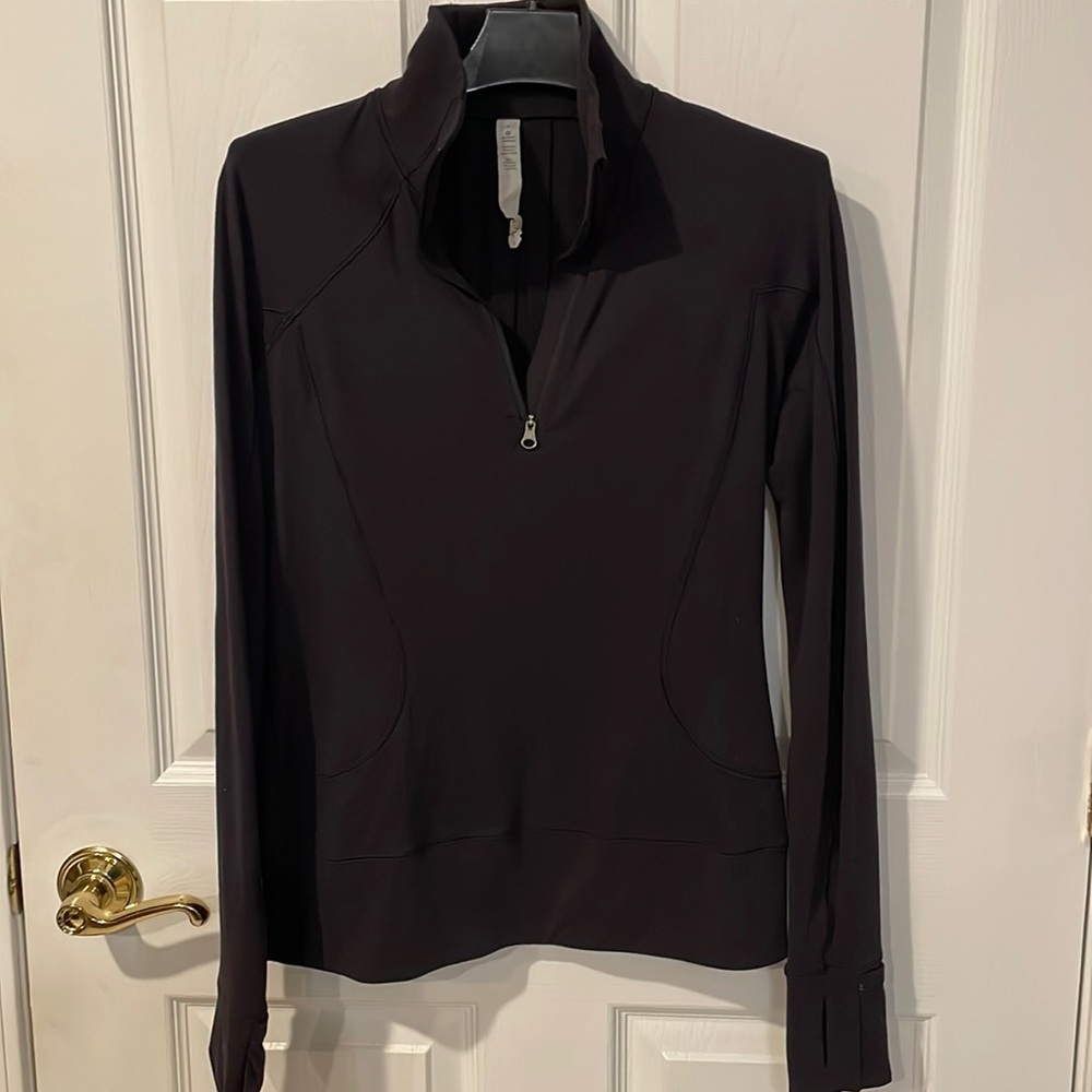 Lululemon size 4 black 1/4 zip, I believe this is rulu material. Barely worn EUC